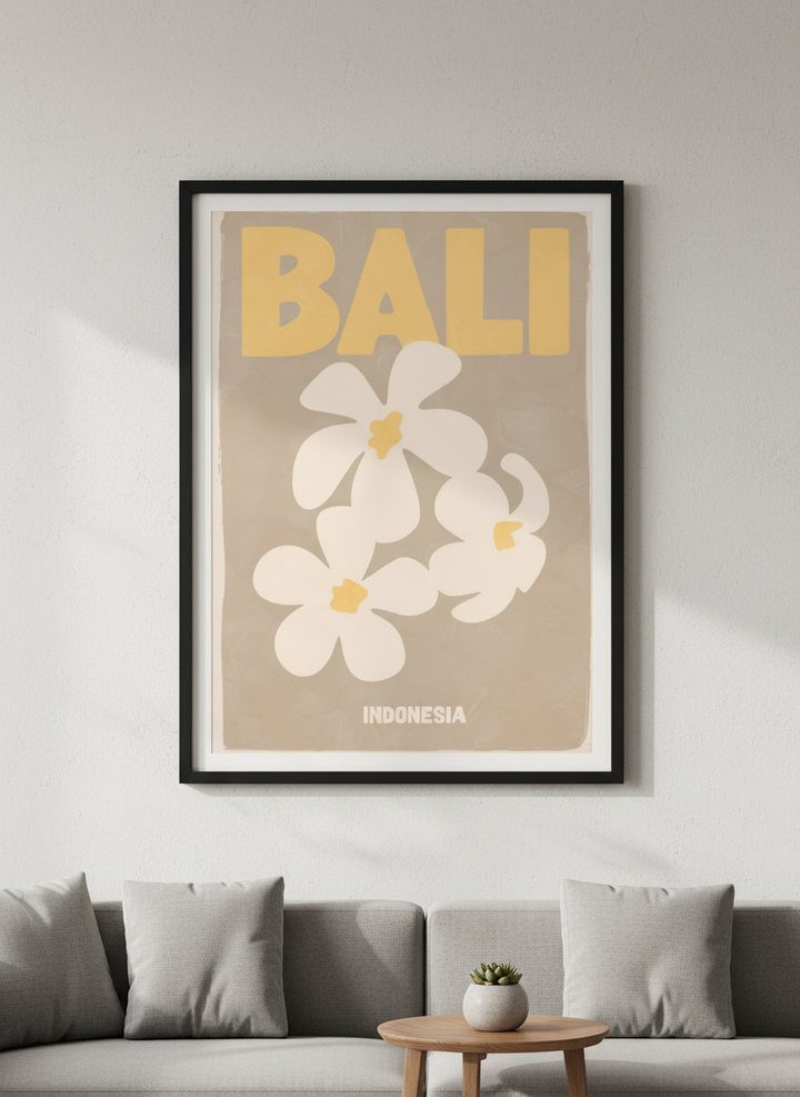 Modern wall art styled above a sofa in a neutral living room