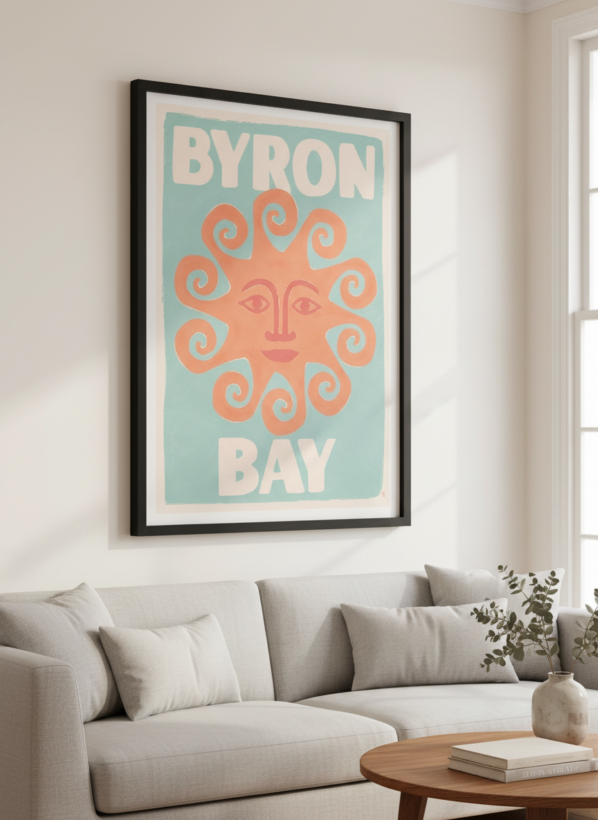 Modern wall art styled above a sofa in a neutral living room