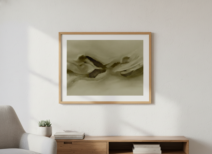 Modern wall art styled above a sofa in a neutral living room