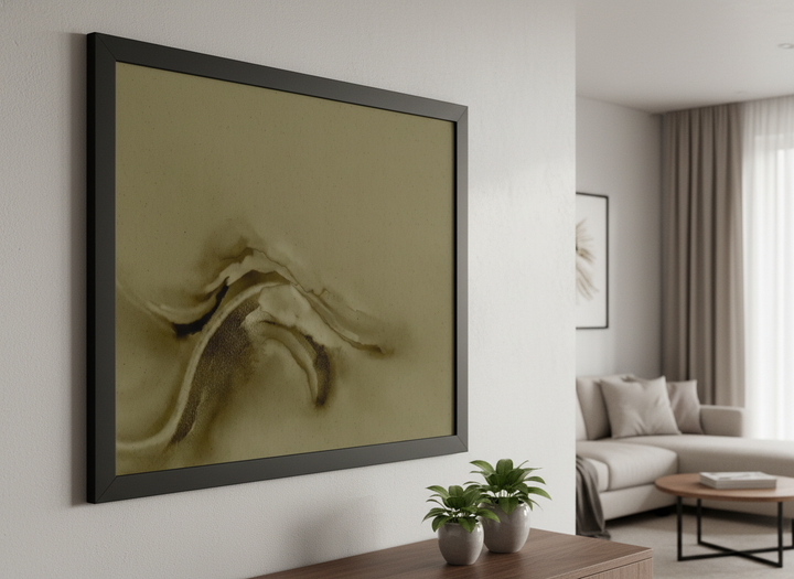 Modern wall art styled above a sofa in a neutral living room