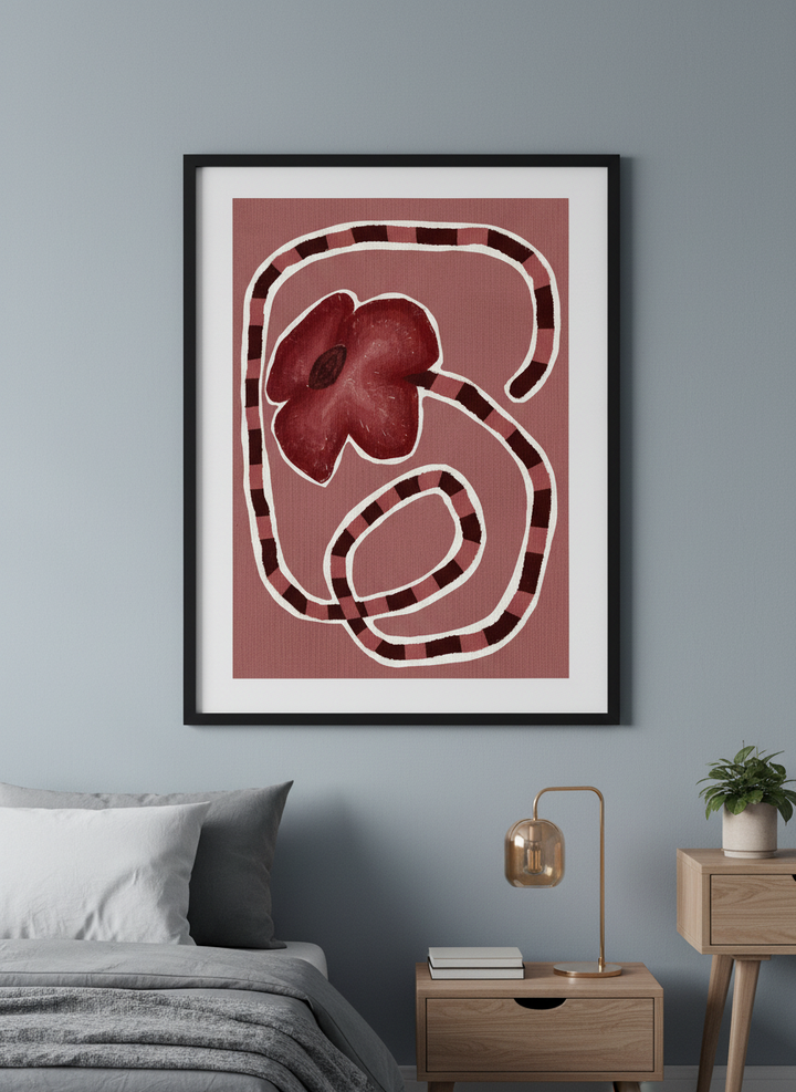 Minimalist artwork displayed in a calm, light-filled bedroom interior