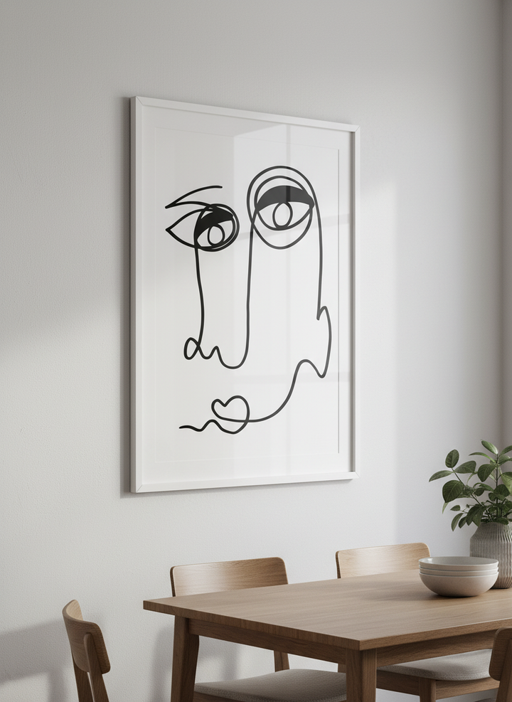 Wall art styled above a dining table in a contemporary home