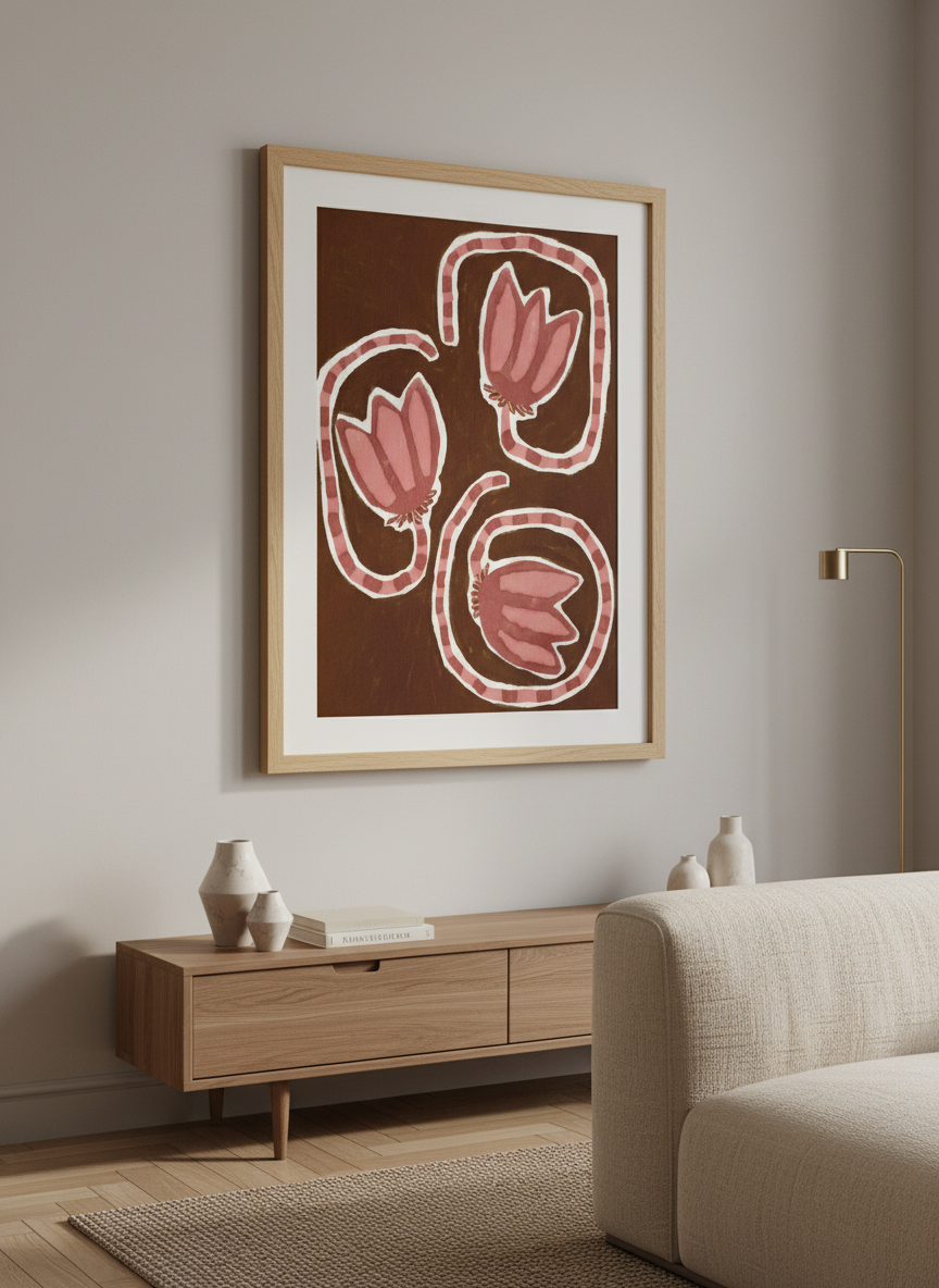 Modern wall art styled above a sofa in a neutral living room