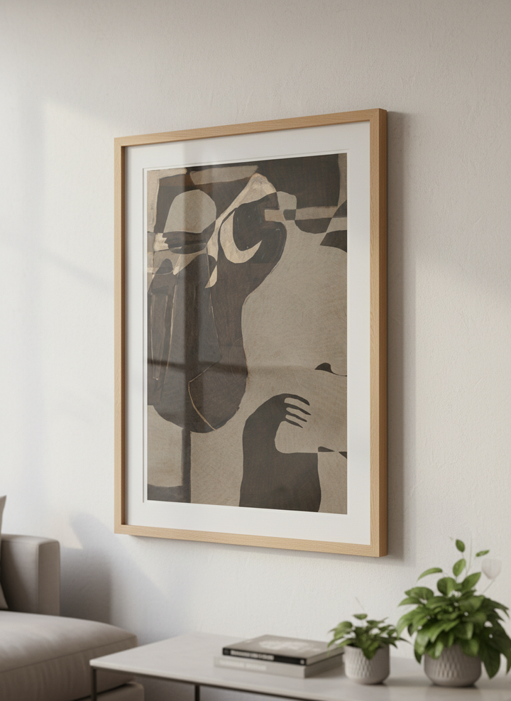 Modern wall art styled above a sofa in a neutral living room