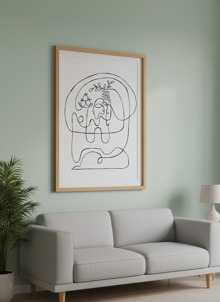Modern wall art styled above a sofa in a neutral living room
