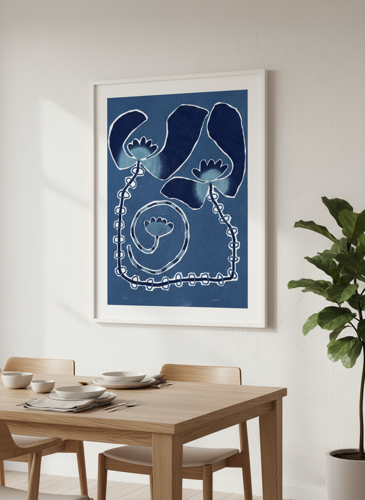 Wall art styled above a dining table in a contemporary home