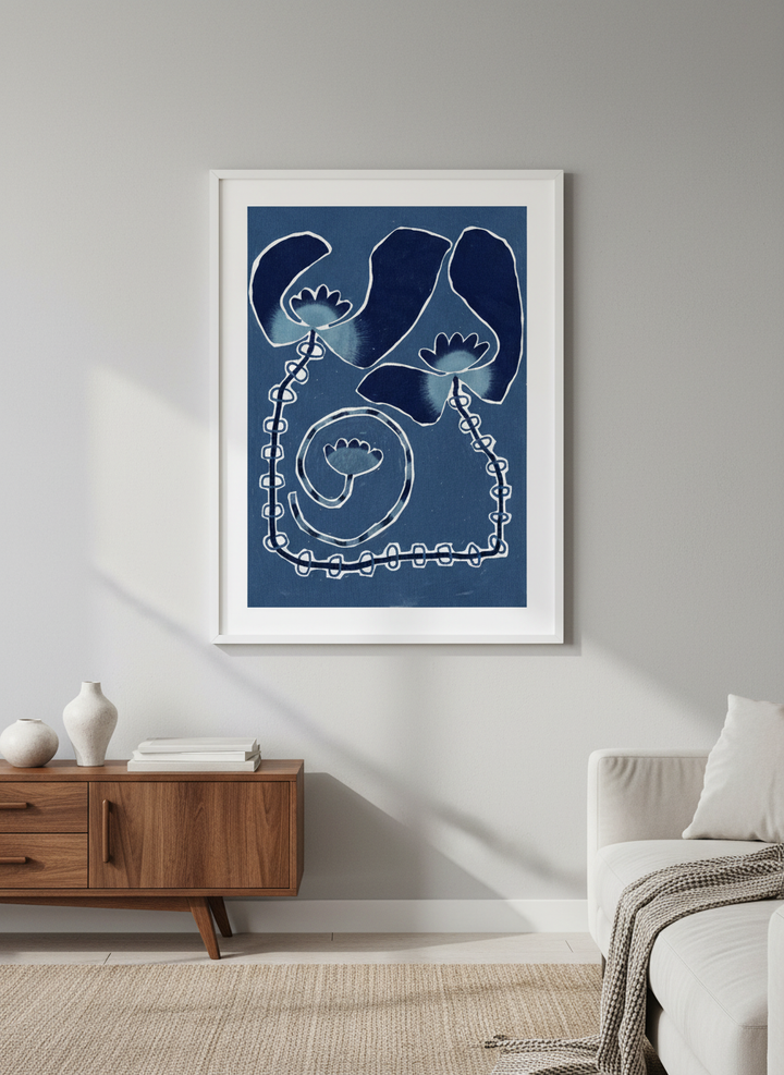 Modern wall art styled above a sofa in a neutral living room