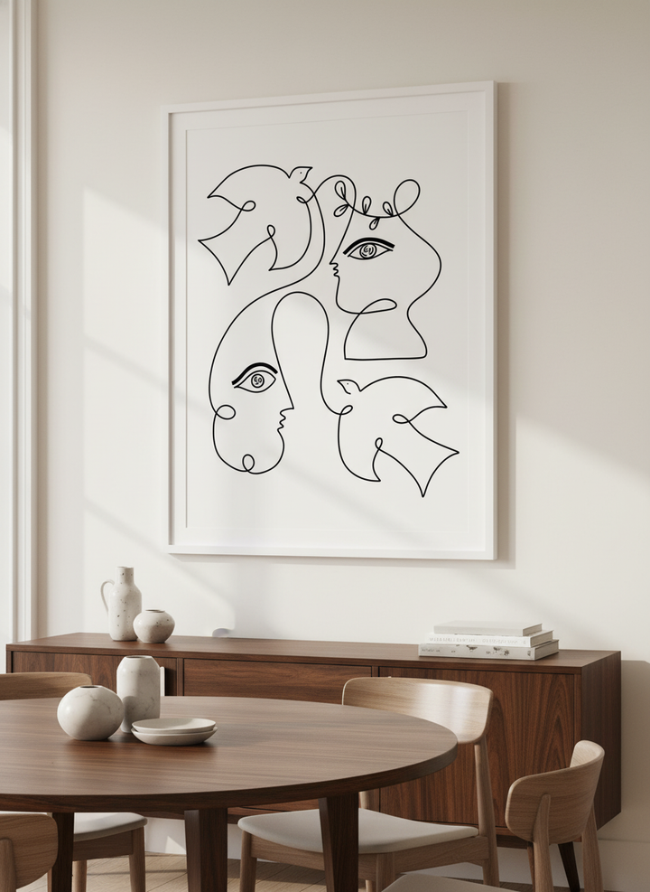 Wall art styled above a dining table in a contemporary home