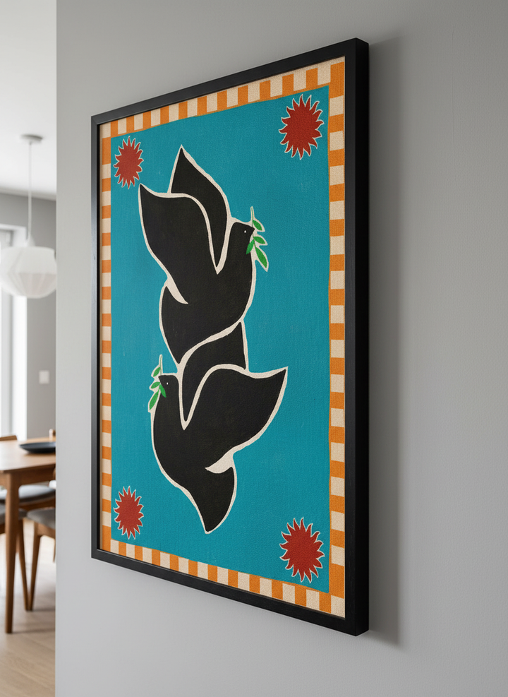 Wall art styled above a dining table in a contemporary home