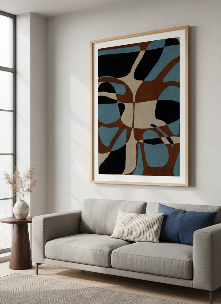 Modern wall art styled above a sofa in a neutral living room