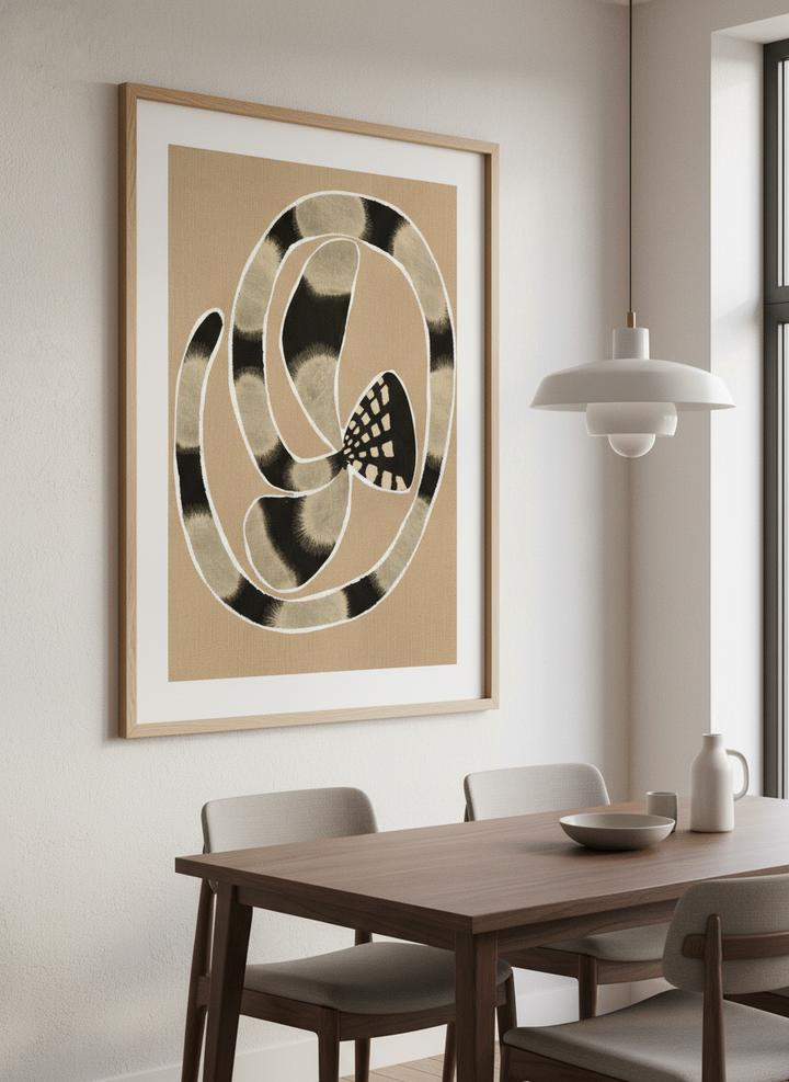 Wall art styled above a dining table in a contemporary home