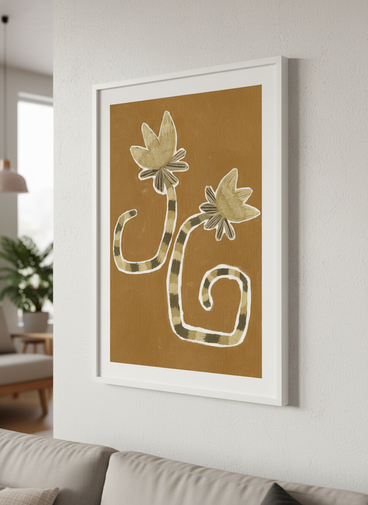 Modern wall art styled above a sofa in a neutral living room