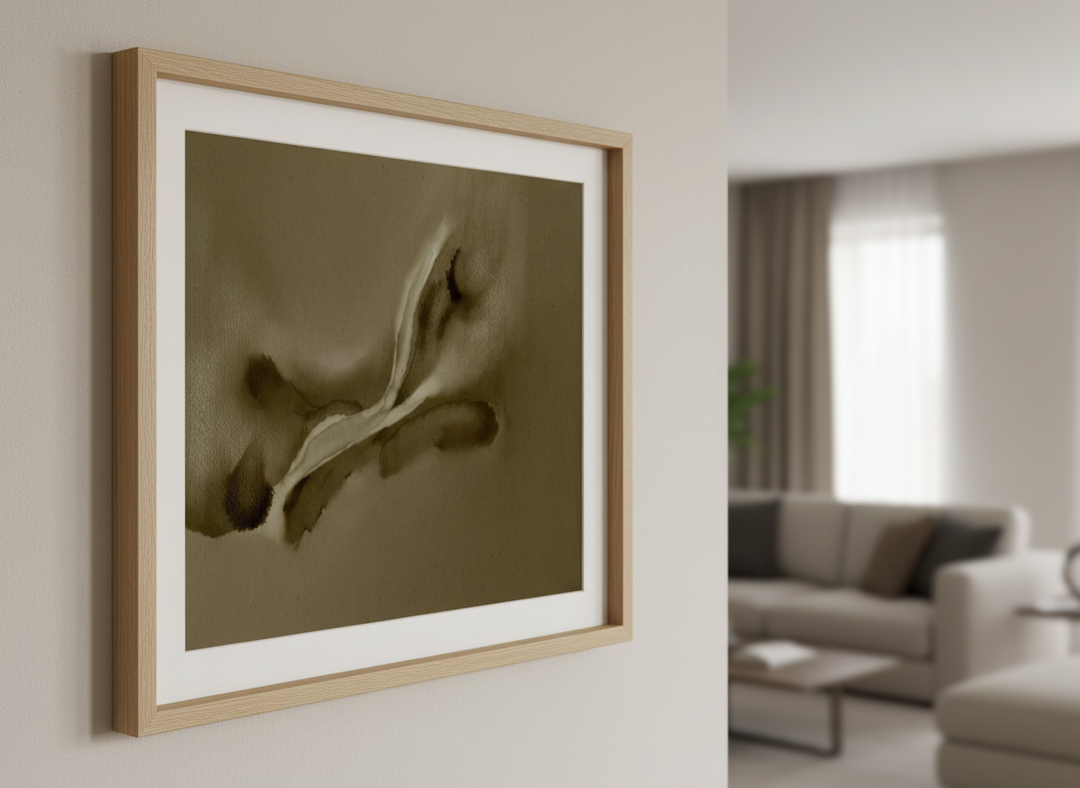 Modern wall art styled above a sofa in a neutral living room