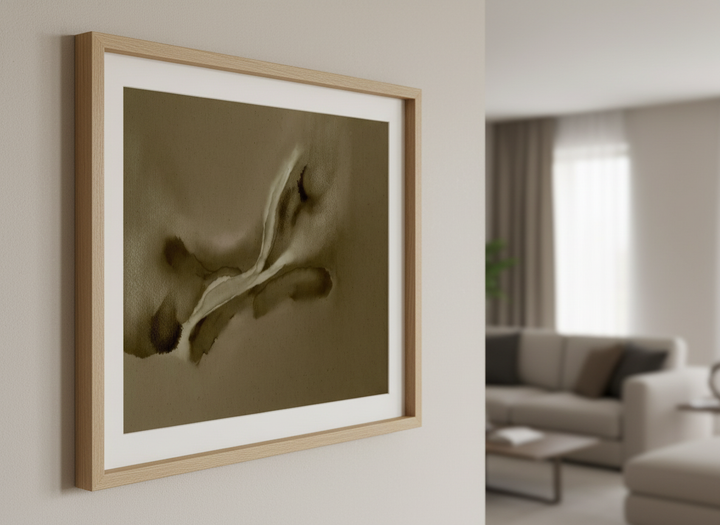Modern wall art styled above a sofa in a neutral living room