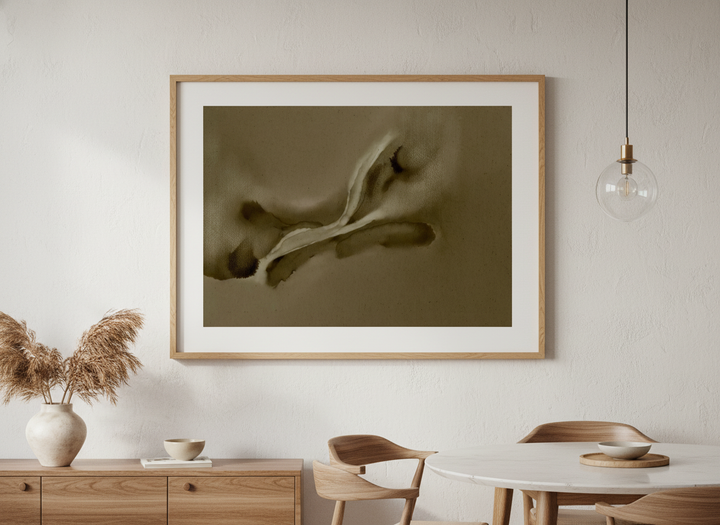Wall art styled above a dining table in a contemporary home