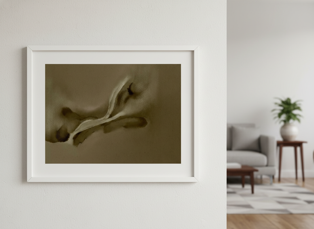 Modern wall art styled above a sofa in a neutral living room