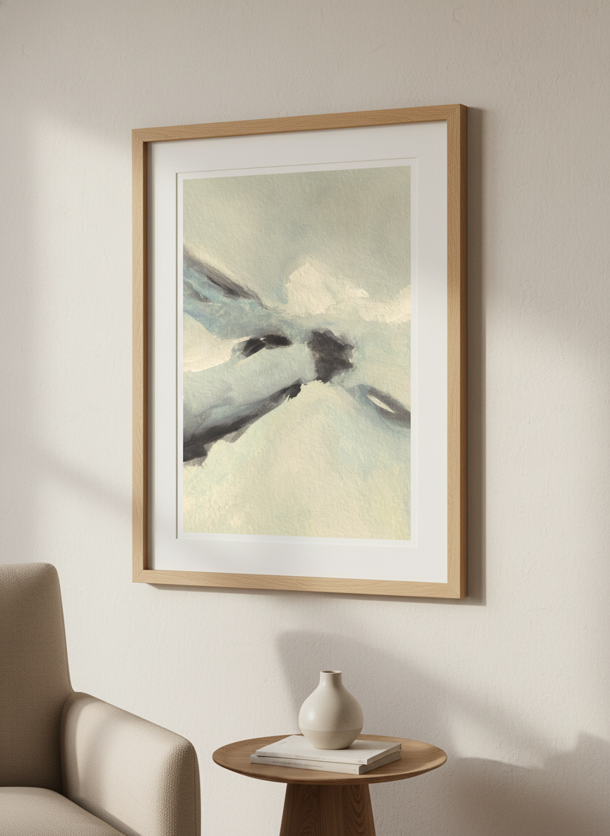 Modern wall art styled above a sofa in a neutral living room