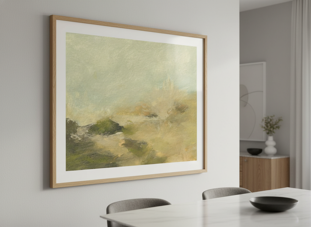 Wall art styled above a dining table in a contemporary home