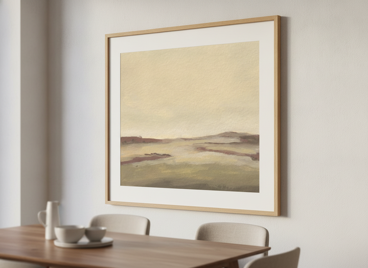 Wall art styled above a dining table in a contemporary home