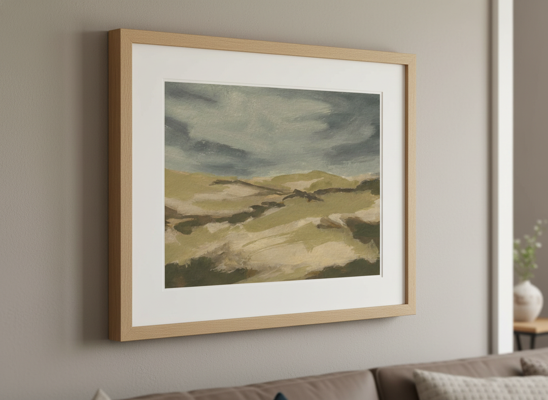 Modern wall art styled above a sofa in a neutral living room