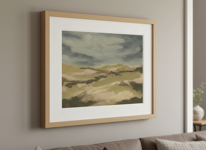 Modern wall art styled above a sofa in a neutral living room