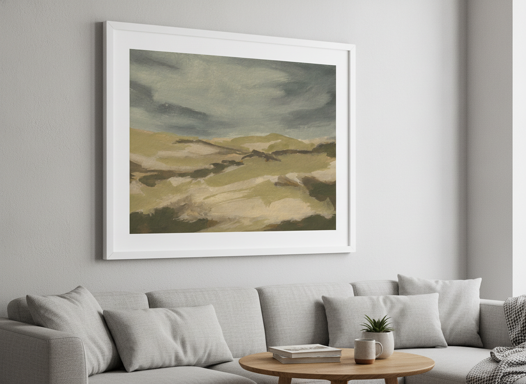 Modern wall art styled above a sofa in a neutral living room
