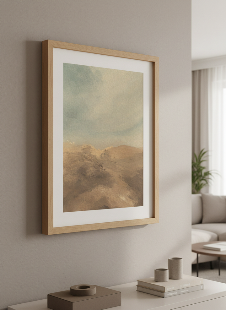 Modern wall art styled above a sofa in a neutral living room