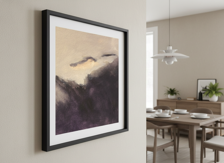 Wall art styled above a dining table in a contemporary home