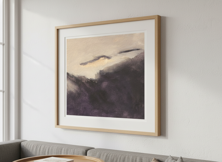 Modern wall art styled above a sofa in a neutral living room