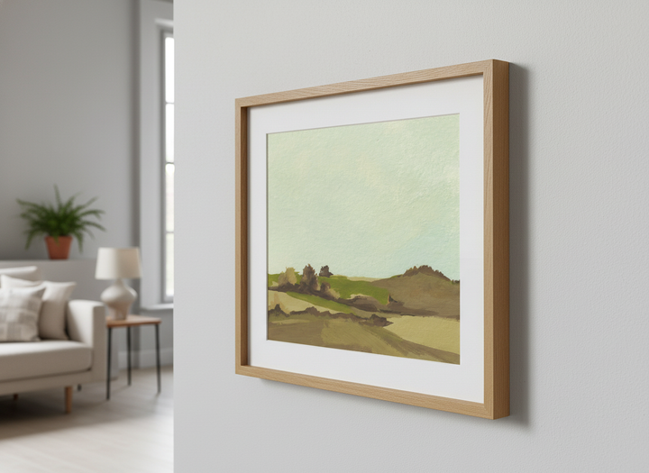 Modern wall art styled above a sofa in a neutral living room