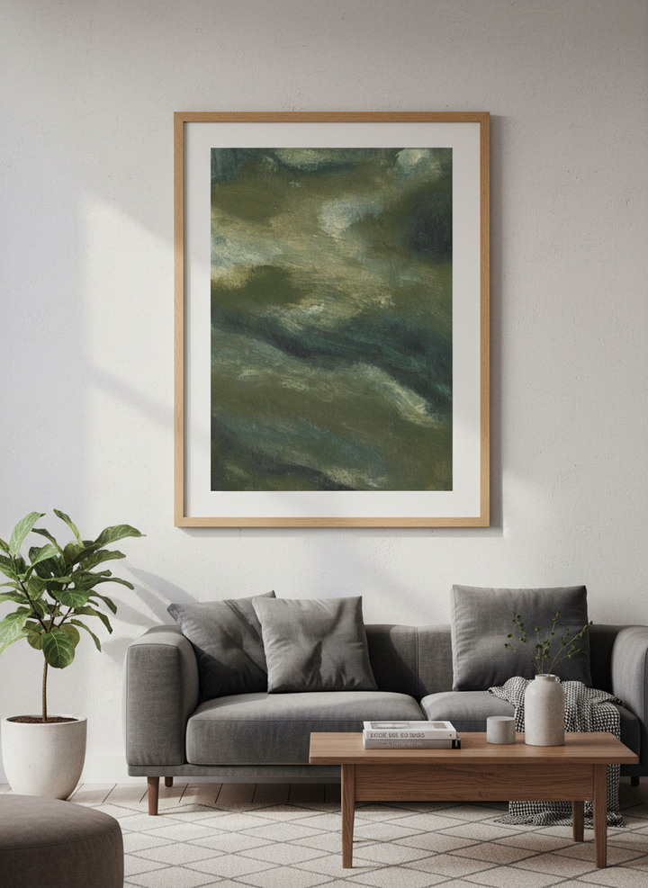 Modern wall art styled above a sofa in a neutral living room