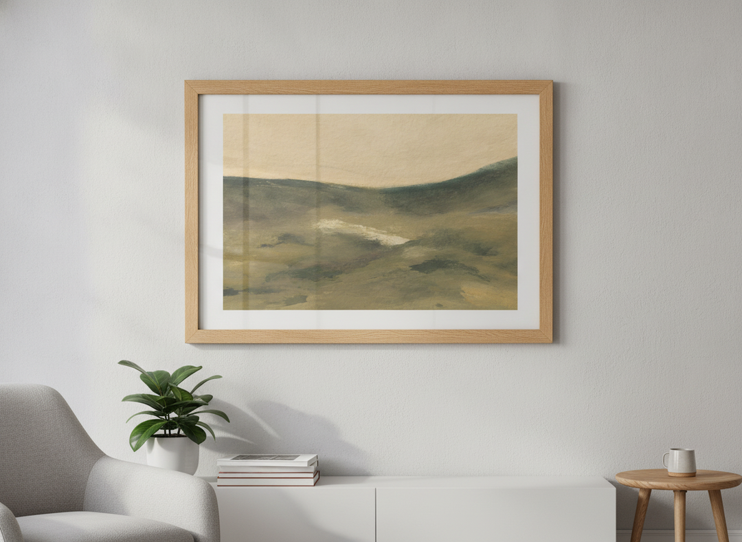 Modern wall art styled above a sofa in a neutral living room