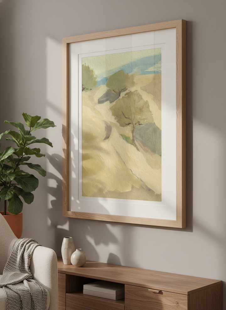 Modern wall art styled above a sofa in a neutral living room