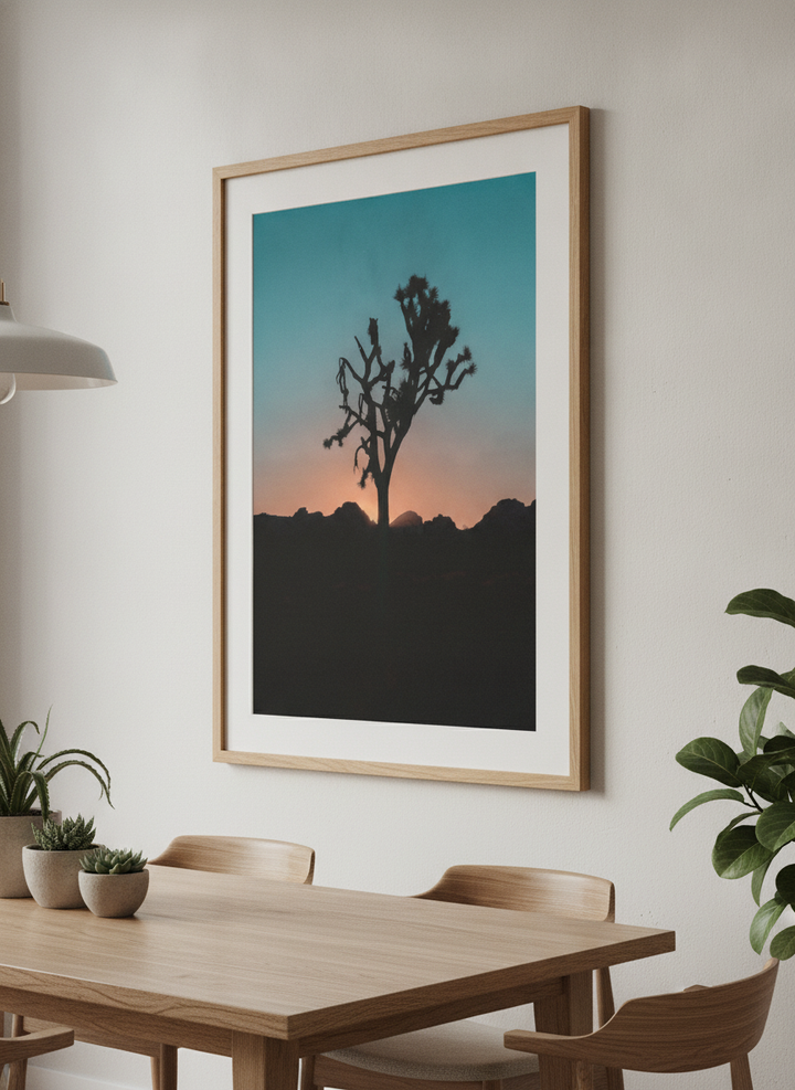 Wall art styled above a dining table in a contemporary home