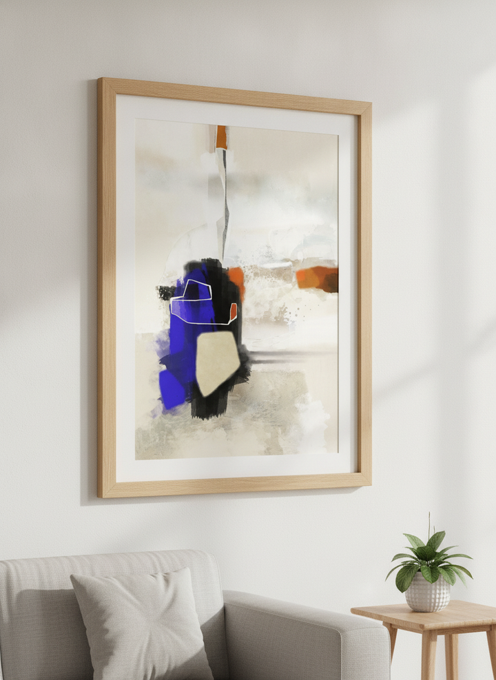 Modern wall art styled above a sofa in a neutral living room