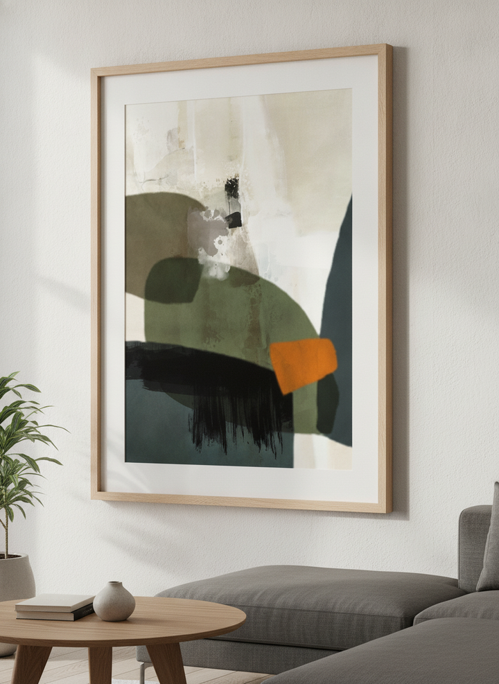 Modern wall art styled above a sofa in a neutral living room