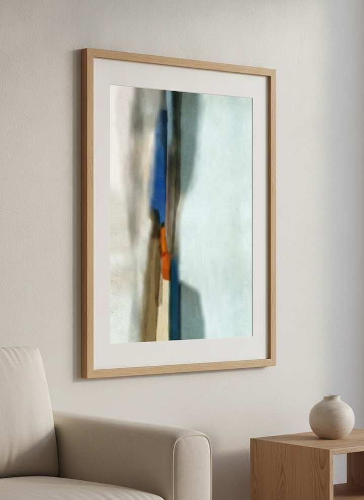 Modern wall art styled above a sofa in a neutral living room