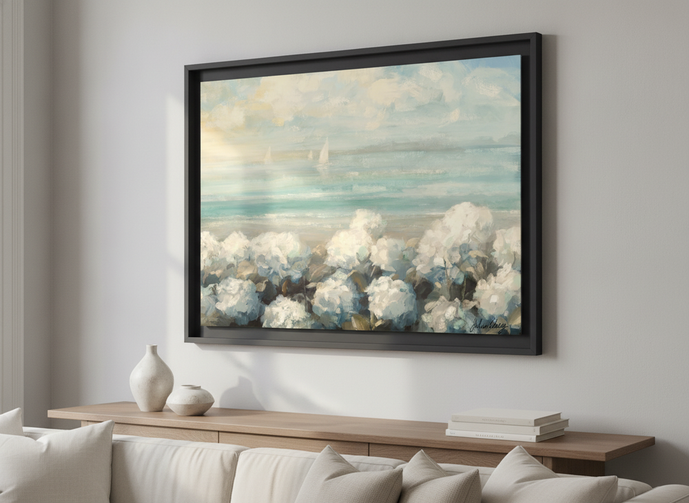 Modern wall art styled above a sofa in a neutral living room