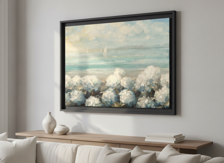 Modern wall art styled above a sofa in a neutral living room