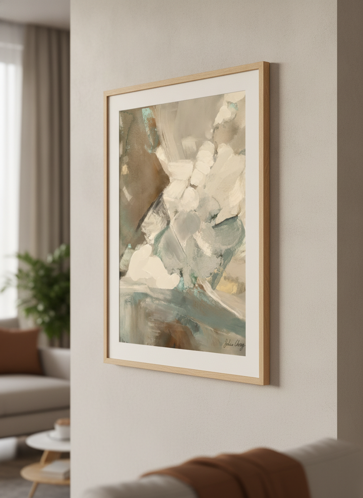 Modern wall art styled above a sofa in a neutral living room