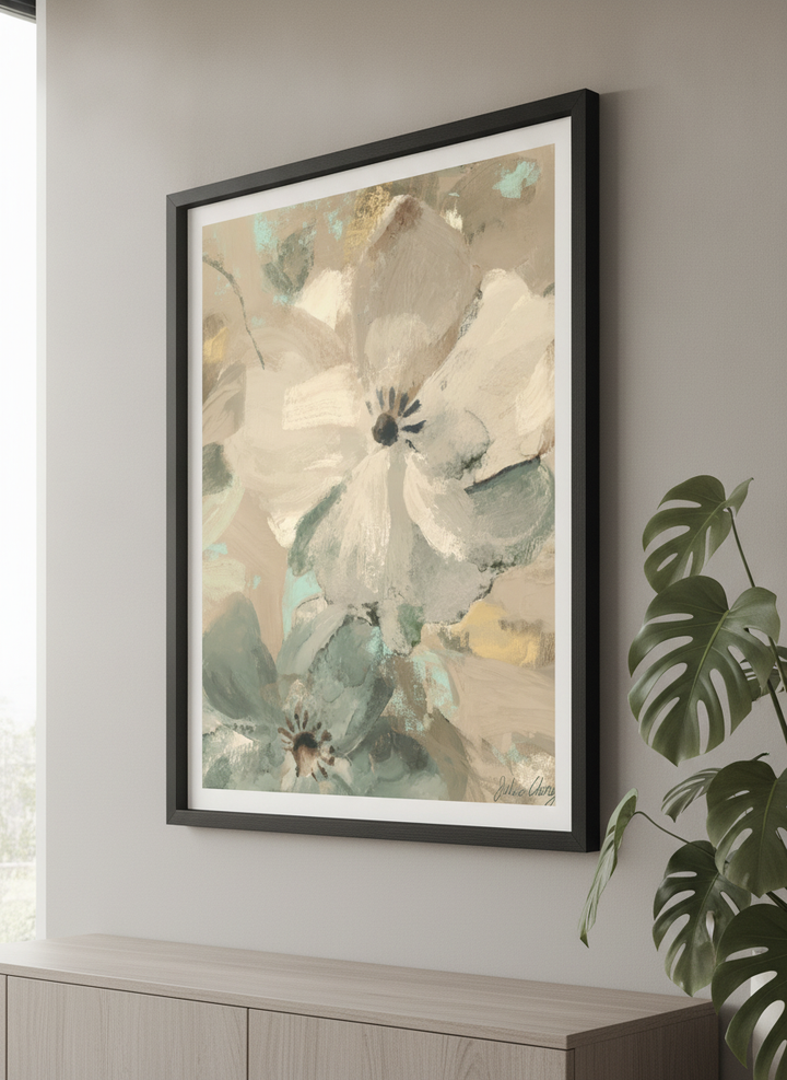 Modern wall art styled above a sofa in a neutral living room