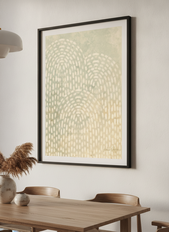 Wall art styled above a dining table in a contemporary home