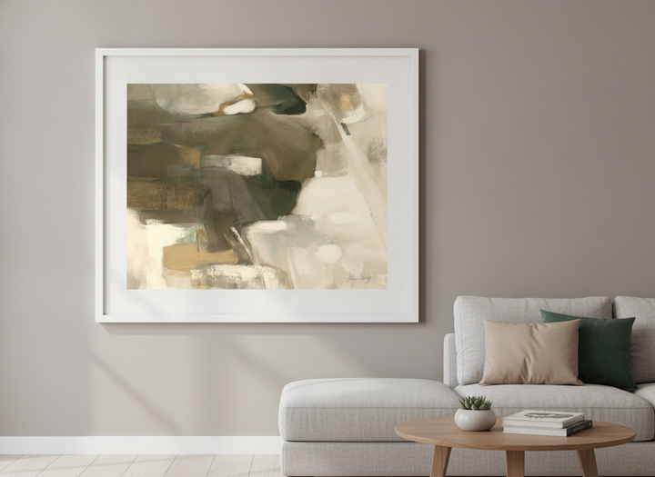 Modern wall art styled above a sofa in a neutral living room
