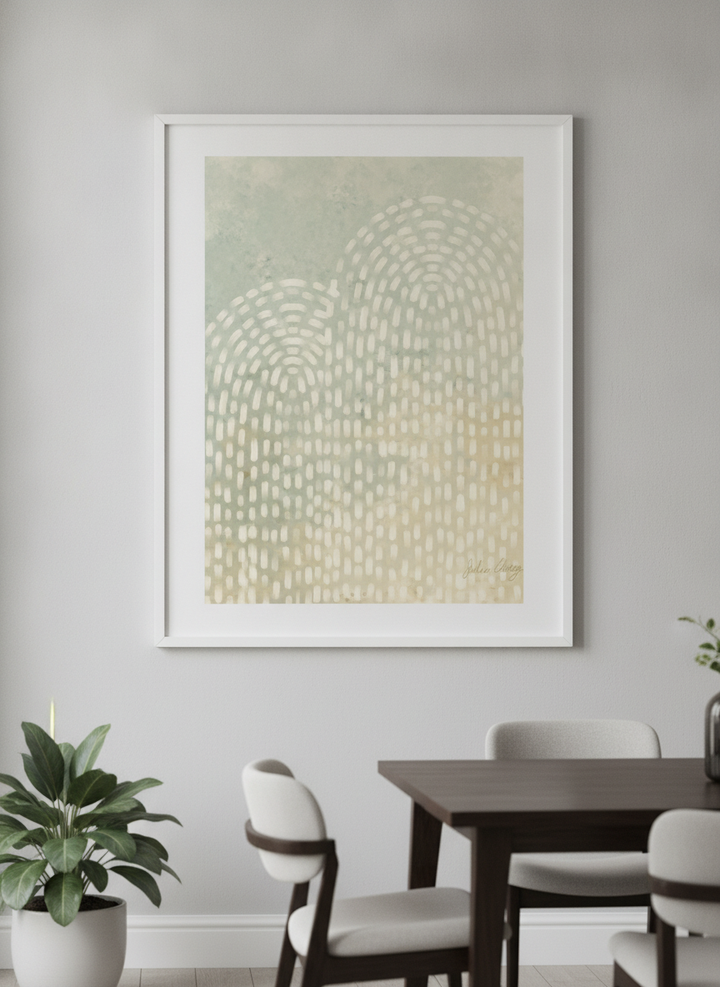 Wall art styled above a dining table in a contemporary home