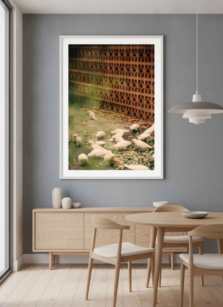 Wall art styled above a dining table in a contemporary home