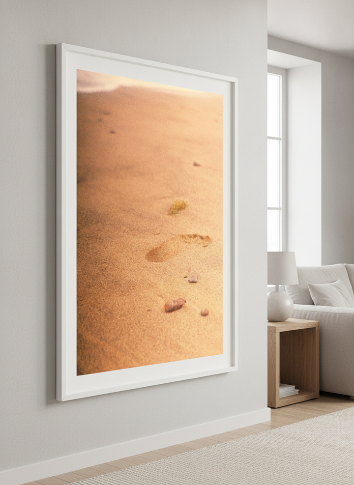 Modern wall art styled above a sofa in a neutral living room