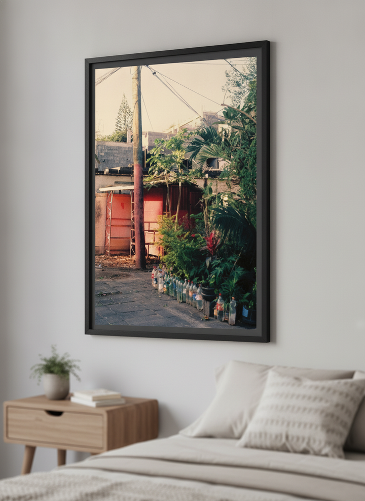 Minimalist artwork displayed in a calm, light-filled bedroom interior