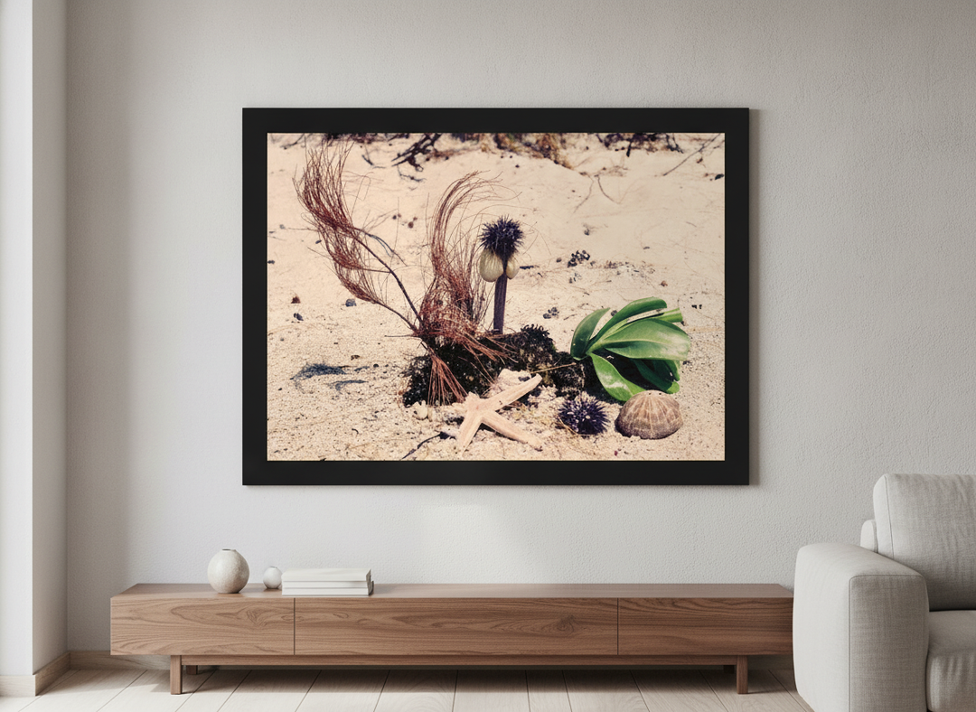 Modern wall art styled above a sofa in a neutral living room