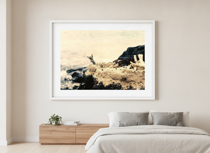 Minimalist artwork displayed in a calm, light-filled bedroom interior