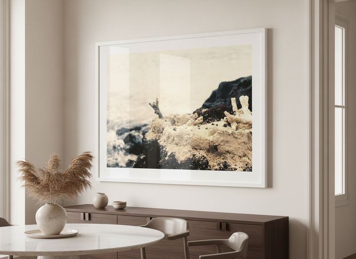 Wall art styled above a dining table in a contemporary home